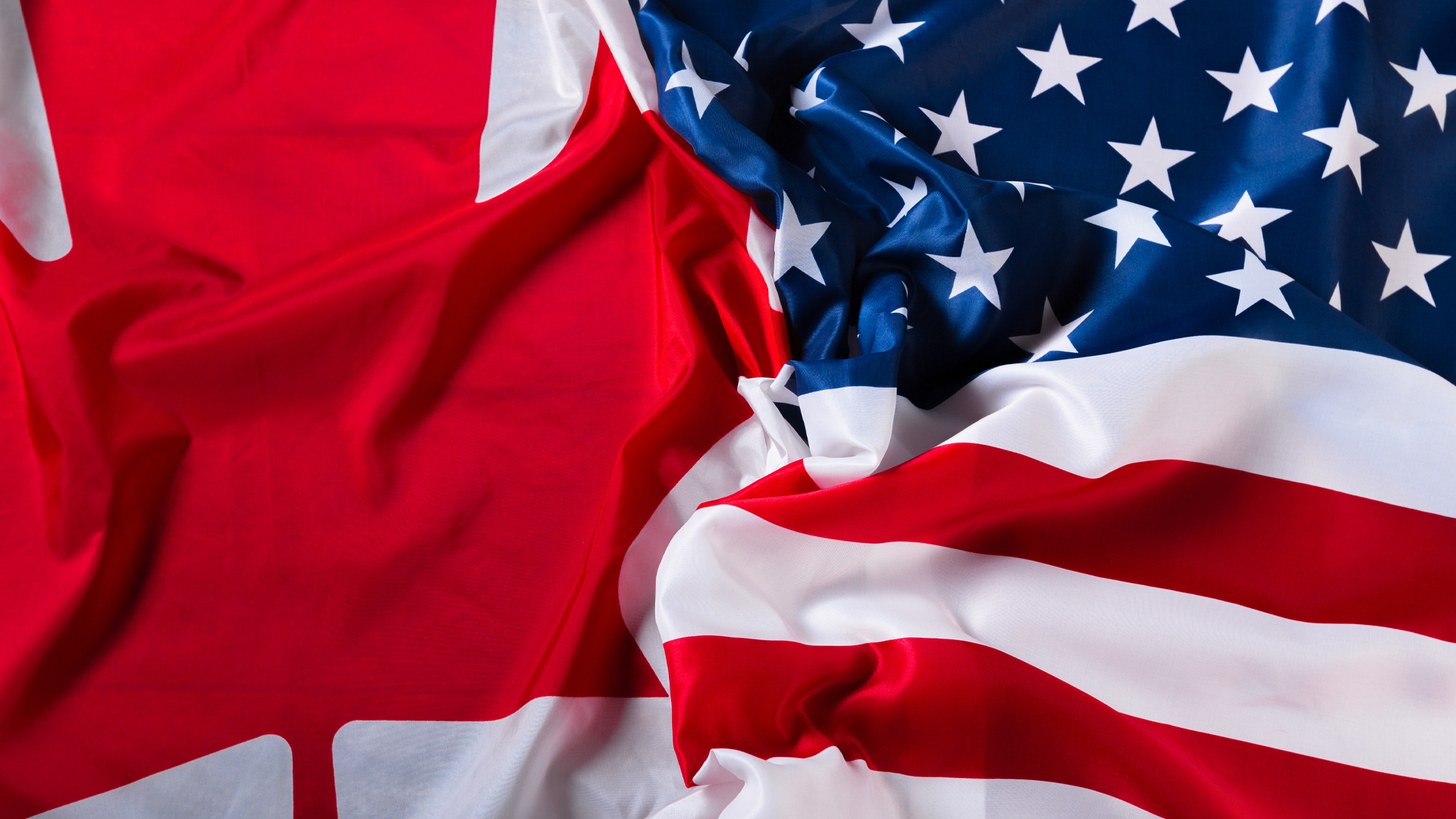 Canadian and US flag used to illustrate a comparison for a featured blog post.
